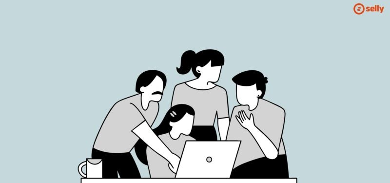 Grafika kreskówkowa czterech osób pochylonych nad laptopem.